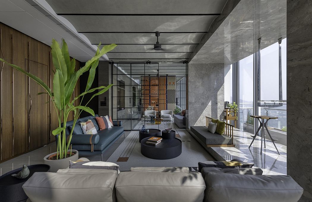 Spacious contemporary living room with concrete walls, wooden accents, and lush greenery.