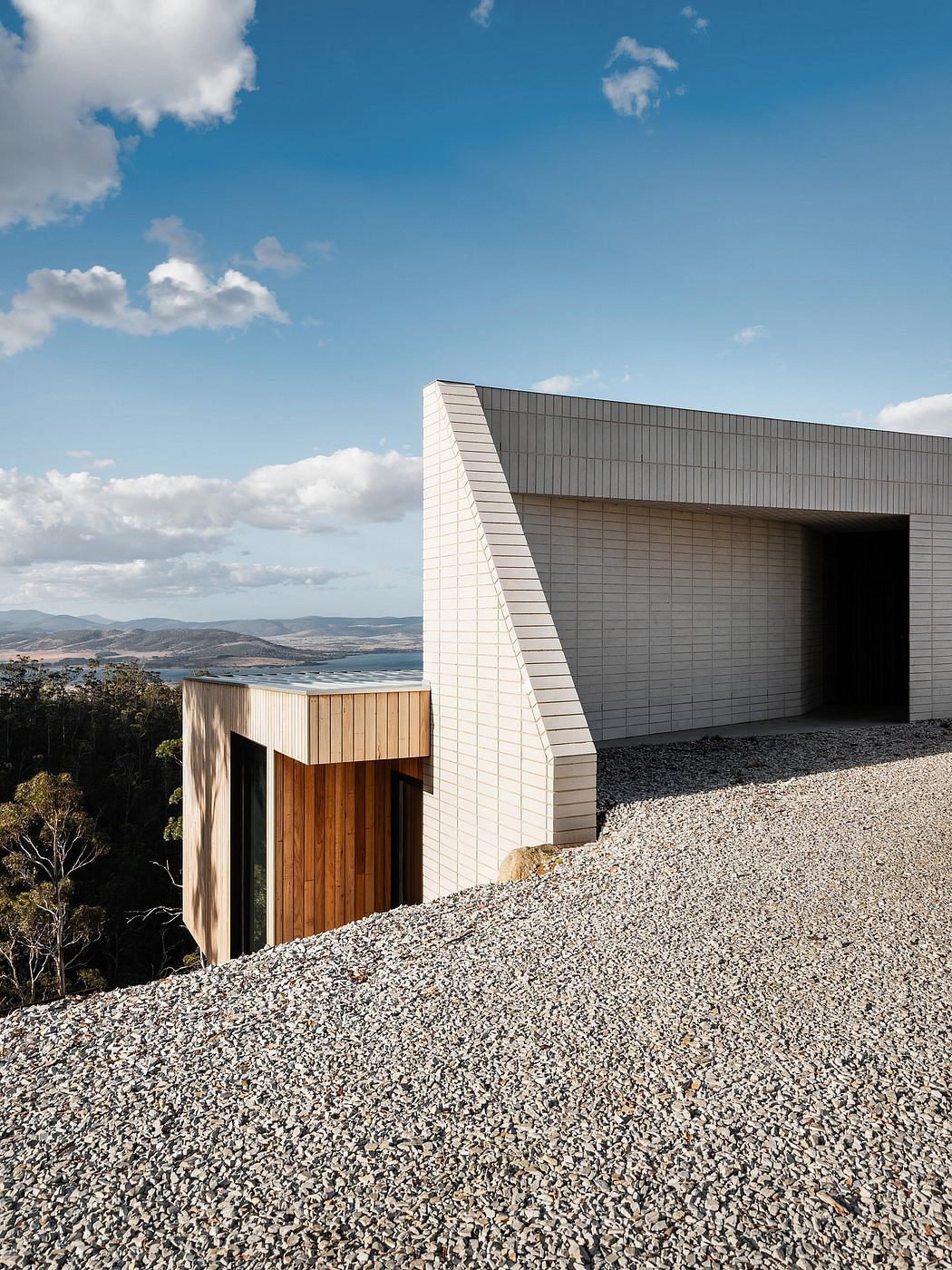 Modern architectural structure with clean lines, contrasting materials, and scenic views.