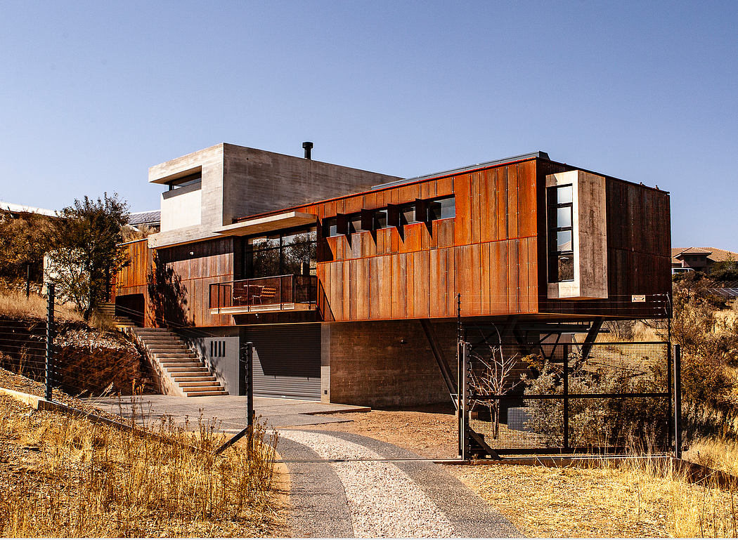 A modern, rustic-inspired structure with a mix of wood, concrete, and glass elements.