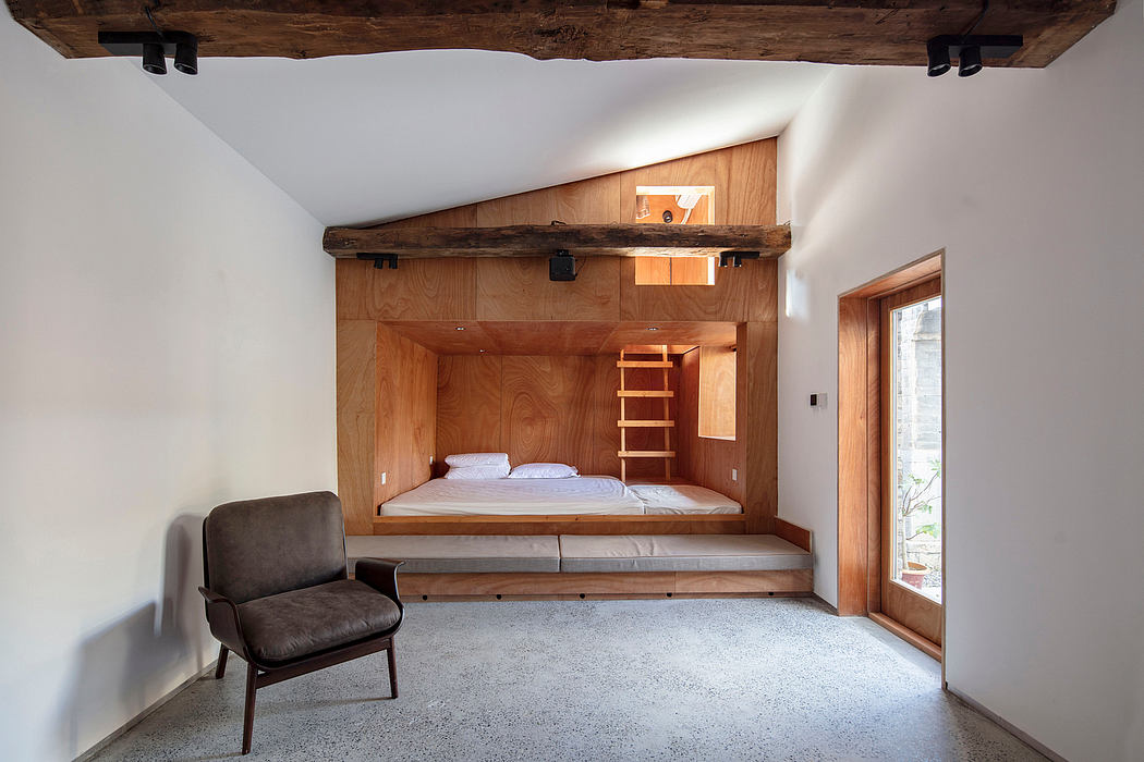 Rustic wooden beams and built-in wooden bed frame with ladder in cozy bedroom interior.