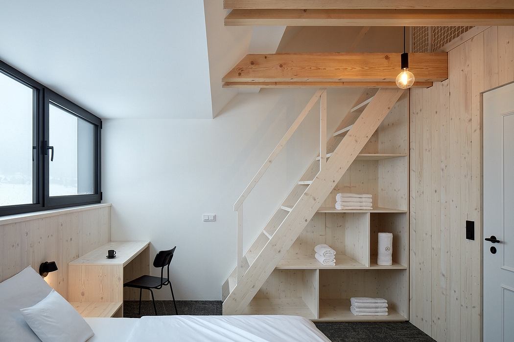 Cozy loft bedroom with wooden beams, shelves, and minimalist furniture.