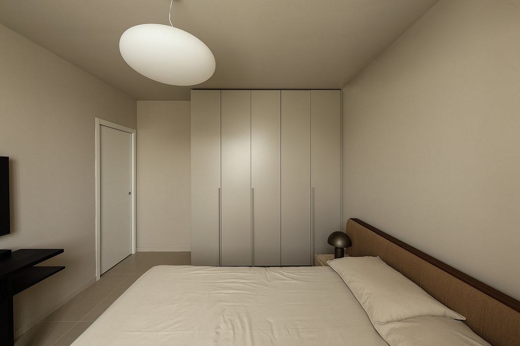 Modern, minimalist bedroom featuring built-in closets, neutral color palette, and pendant lighting.