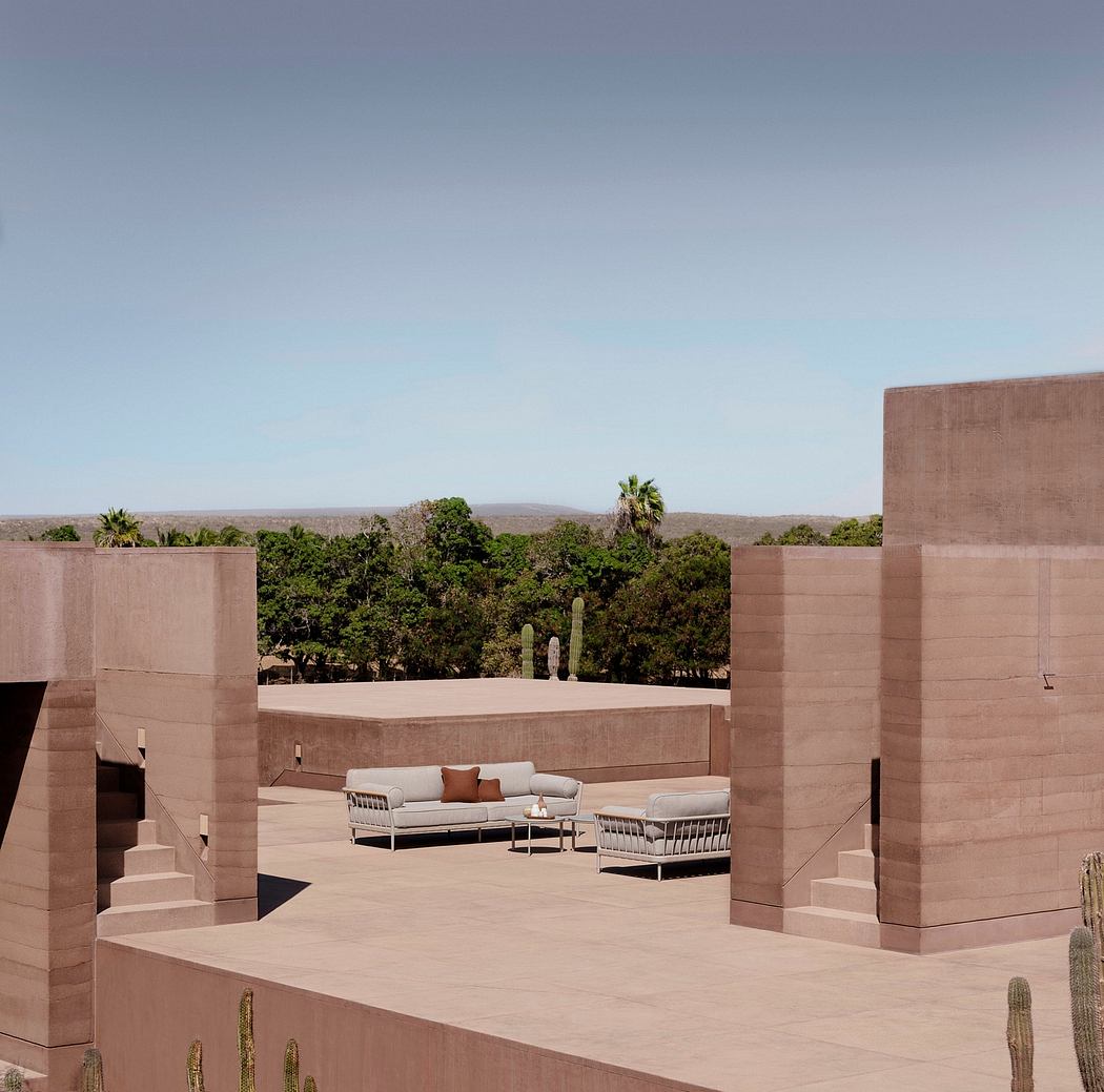 Minimalist desert-inspired architectural design with terraced lounge seating.