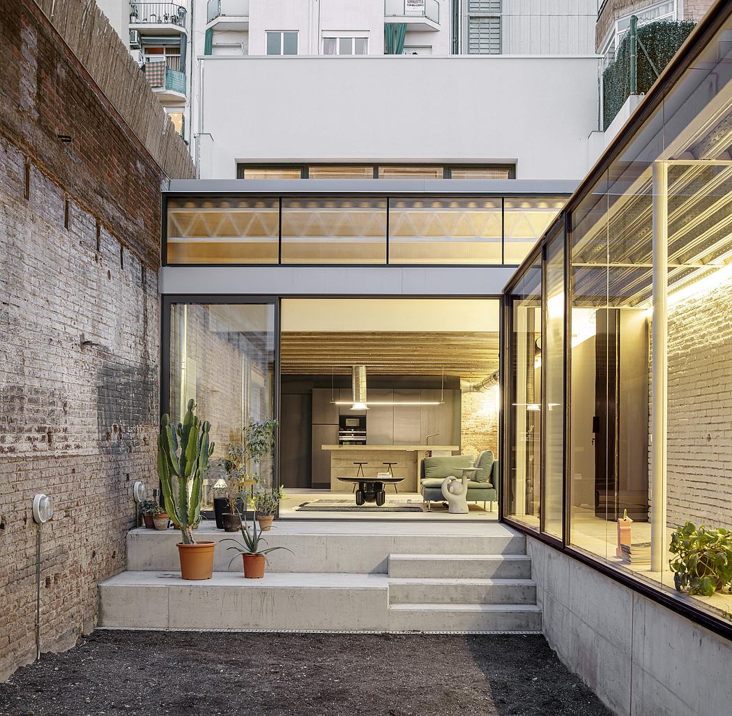 Contemporary industrial-style interior with exposed brick, concrete, and warm-toned wood.