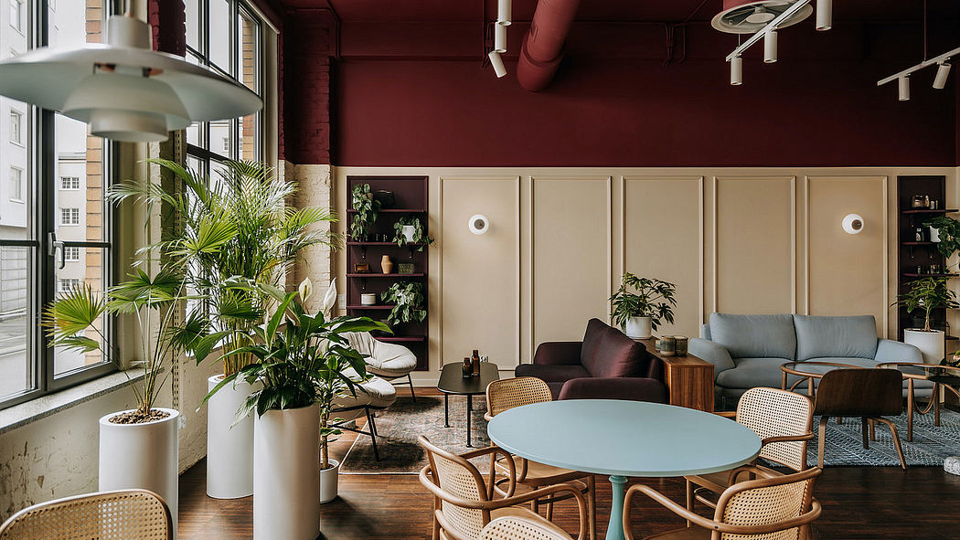 Cozy and inviting lounge with modern furniture, natural textures, and lush greenery.