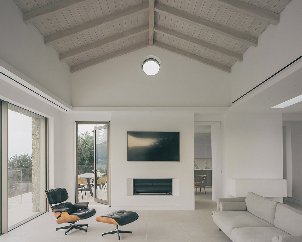 Spacious living room with vaulted ceiling, fireplace, and modern furniture.