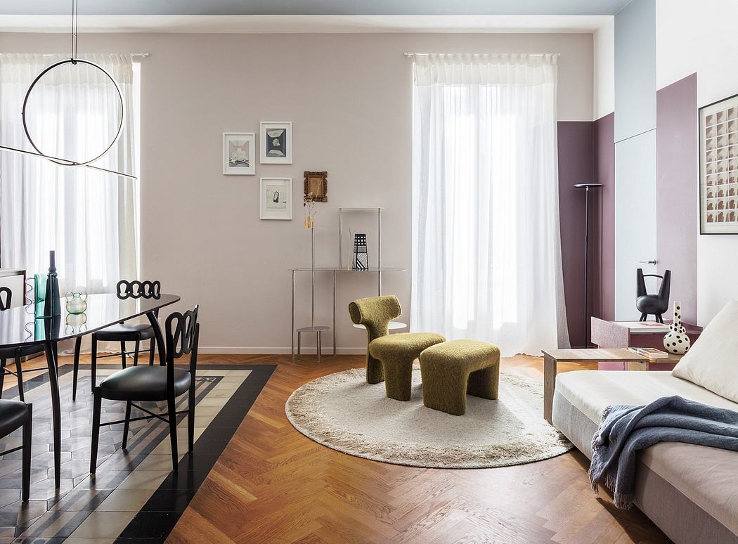 Light-filled living room with modern furniture and decor accents, hardwood flooring, and stylish curtains.