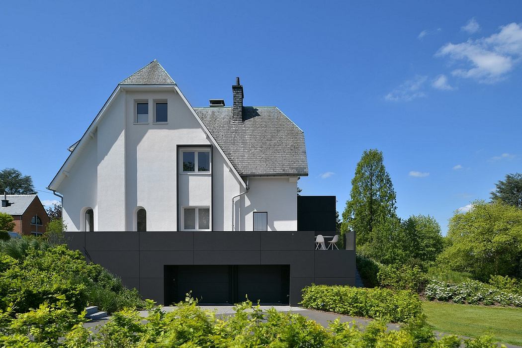 A modern luxury home with a slanted roof and bold black exterior elements.