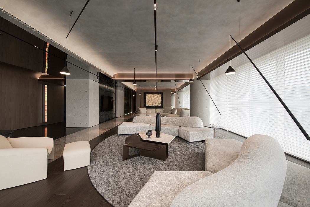 A modern, high-contrast living space with concrete walls, sleek lighting, and plush furnishings.