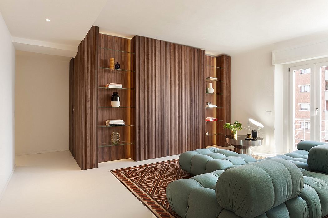 Modern, open-concept living room with wooden wall paneling and custom shelving.