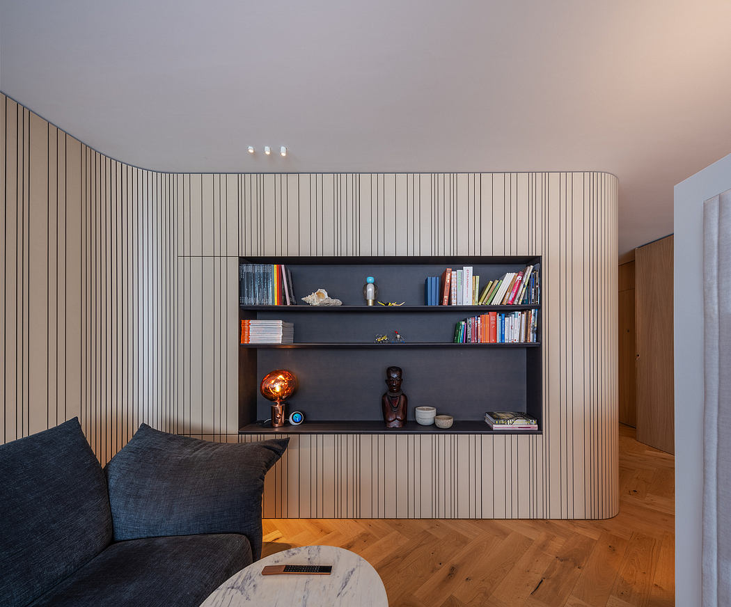 Striking minimalist interior with built-in wood-paneled shelving and modern furniture.