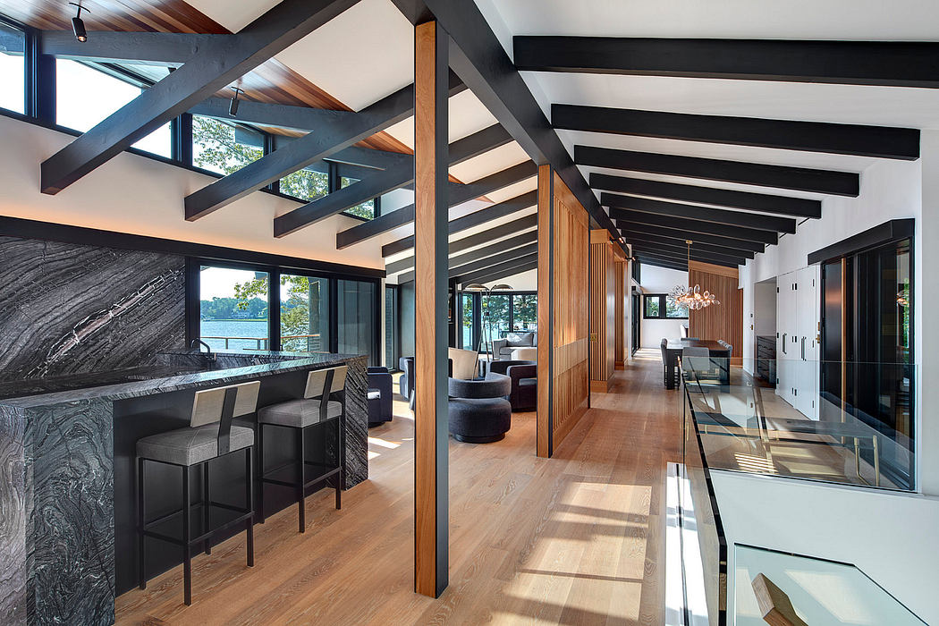 Spacious modern interior featuring striking wooden beams, sleek furnishings, and ample natural light.