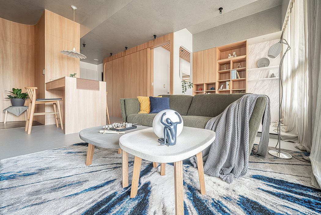 Contemporary living room with wooden paneling, built-in shelving, and a geometric coffee table.