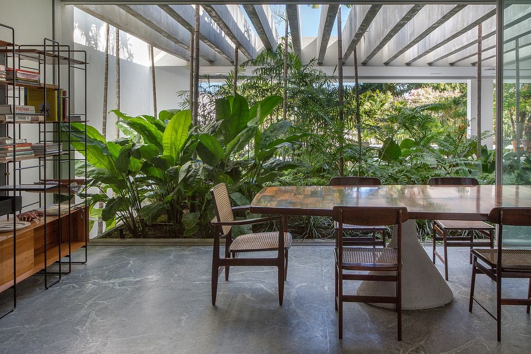 Lush indoor greenery, modern architectural details, and a minimalist dining setup.