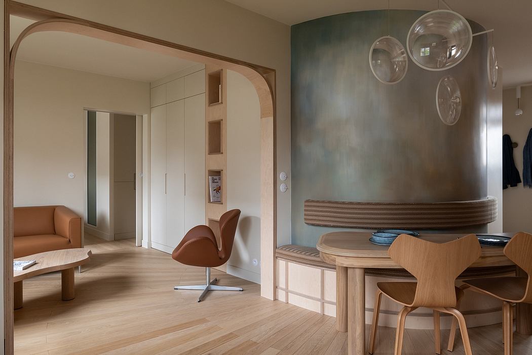 Modern, minimalist interior with clean lines, warm wood tones, and playful lighting fixtures.