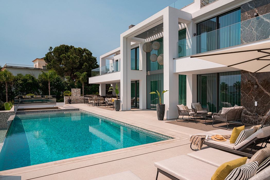 Luxurious modern villa with a sleek geometric design, expansive terrace, and inviting pool.