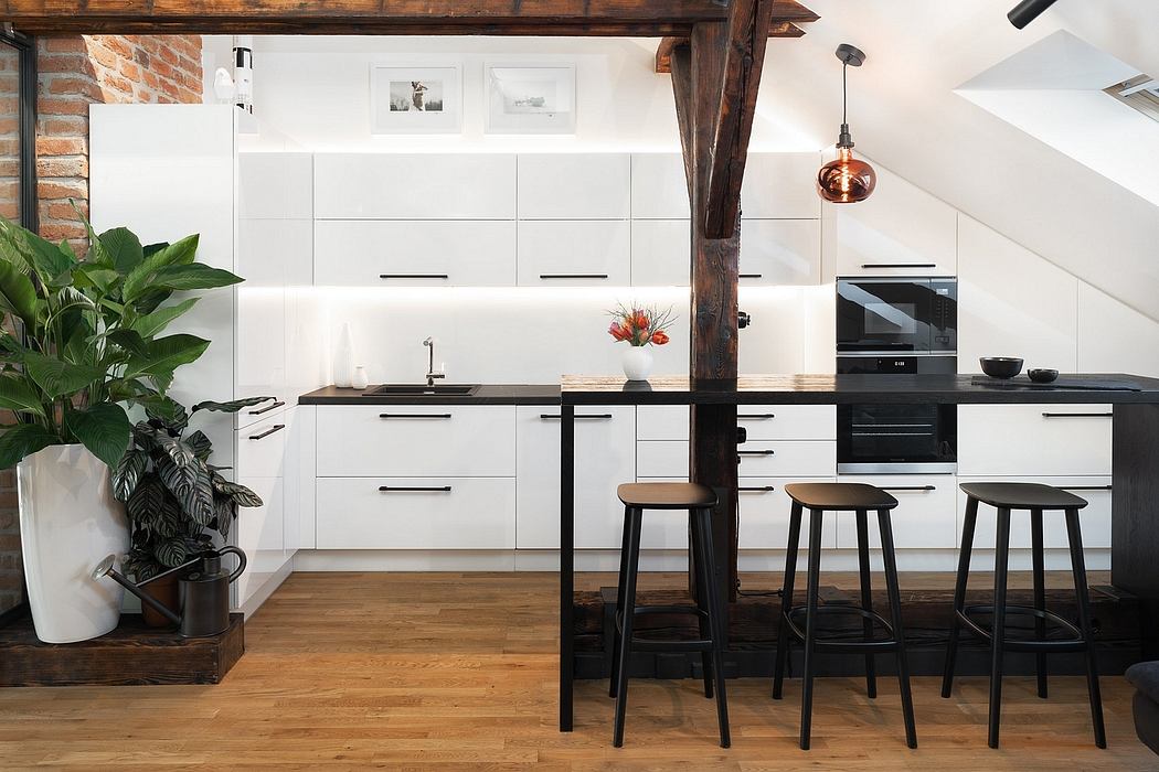 Modern kitchen with white cabinets, exposed brick, and industrial-style furnishings.