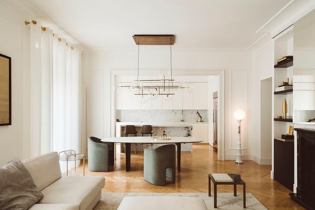 Spacious modern dining room with minimalist decor, wooden floors, and a statement light fixture.