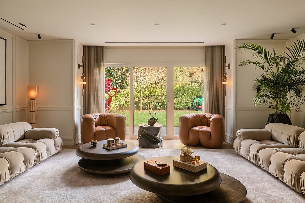 Spacious living room with large windows overlooking a lush garden, featuring plush furniture and decor.