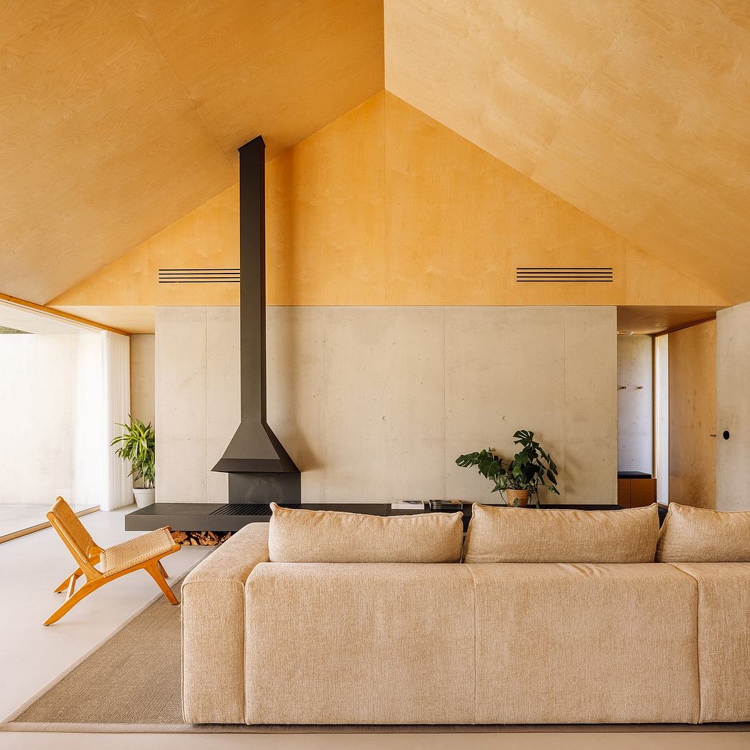Warm, minimalist living room with statement fireplace, natural textures, and modern furnishings.