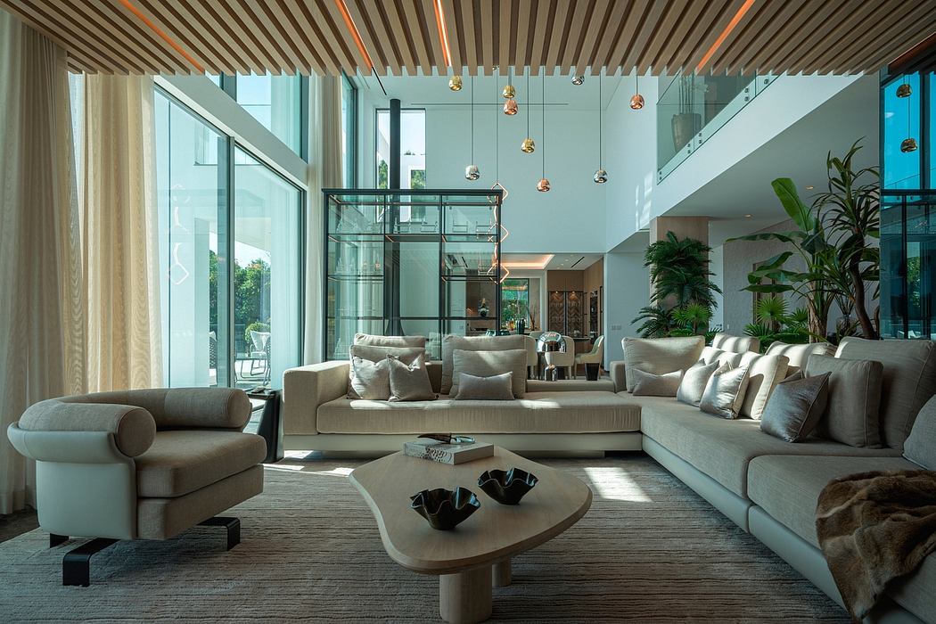 Sleek, modern lounge with high ceilings, pendant lighting, and glass walls showcasing nature.
