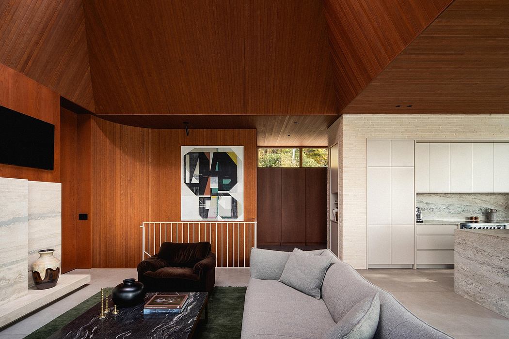 Warm-toned wood ceilings, modern furniture, and abstract artwork in a cozy living space.
