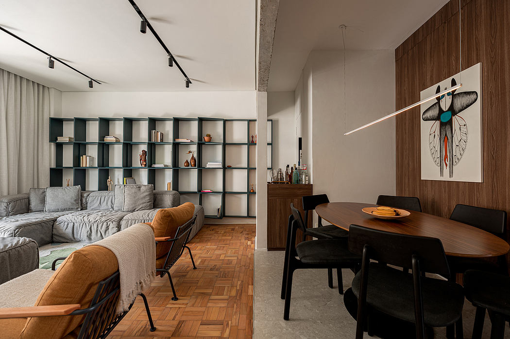 Modern open-plan living room and dining area with stylish furnishings and decor.