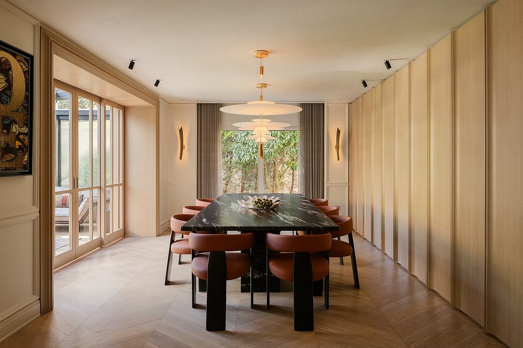 Elegant dining room with modern light fixtures, wooden walls, and a large marble table.