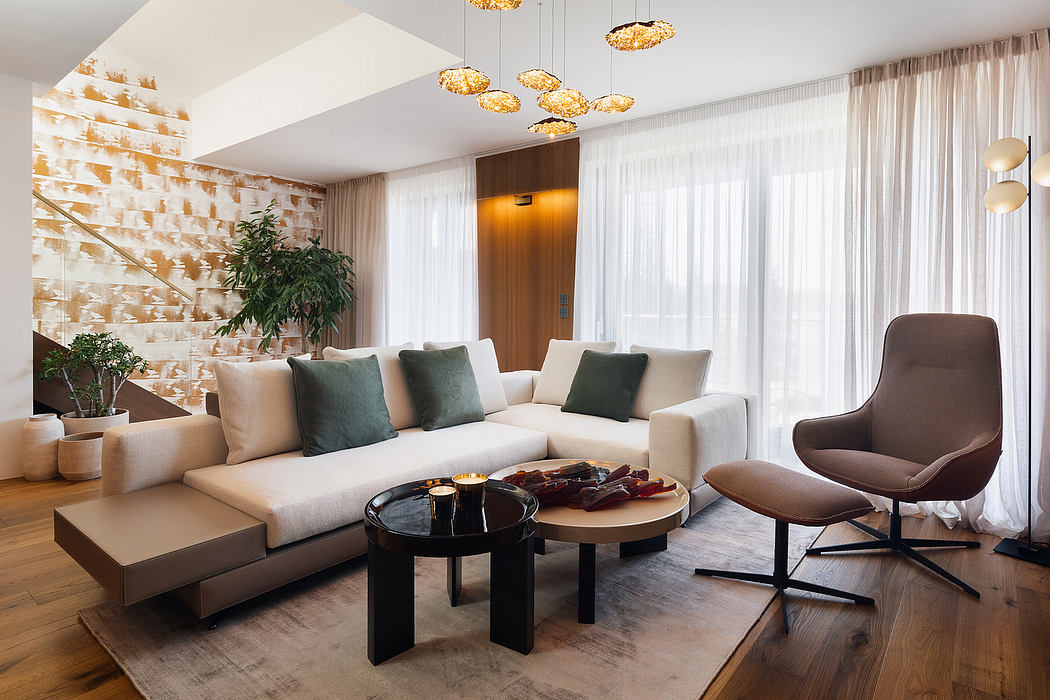 Elegant modern living room with sleek furnishings, statement lighting, and plush textures.