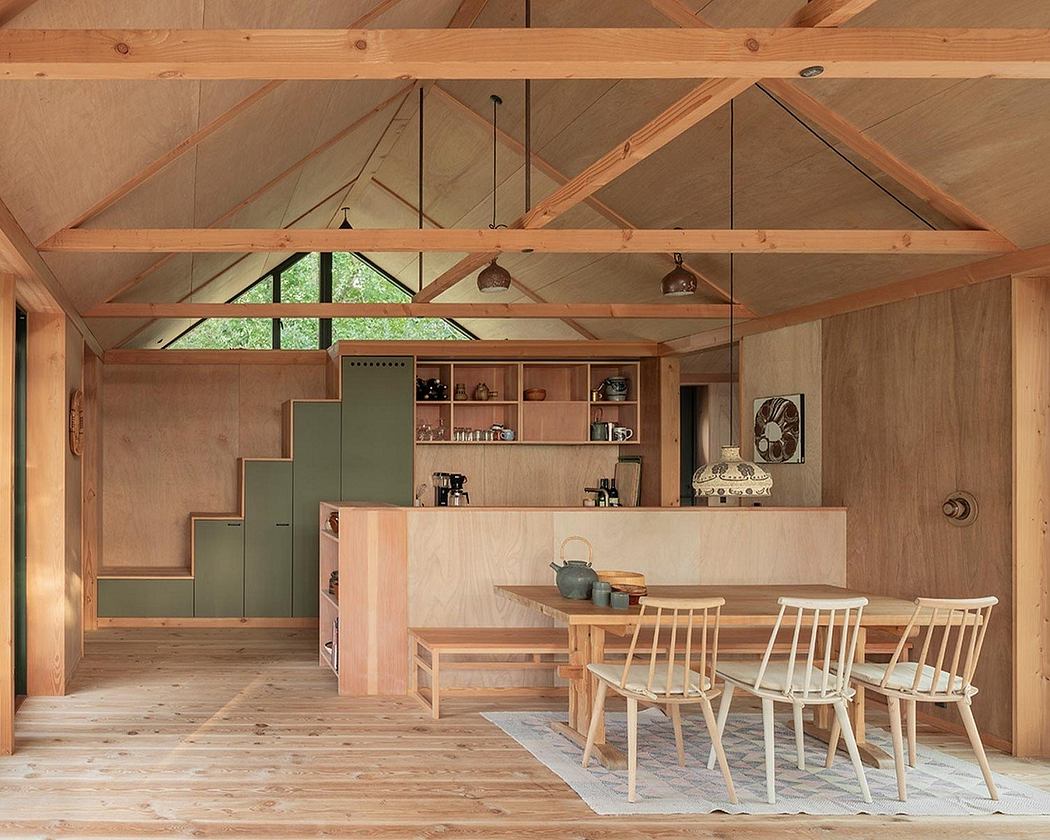 Warm wooden interior with rustic architectural elements and minimalist furnishings.