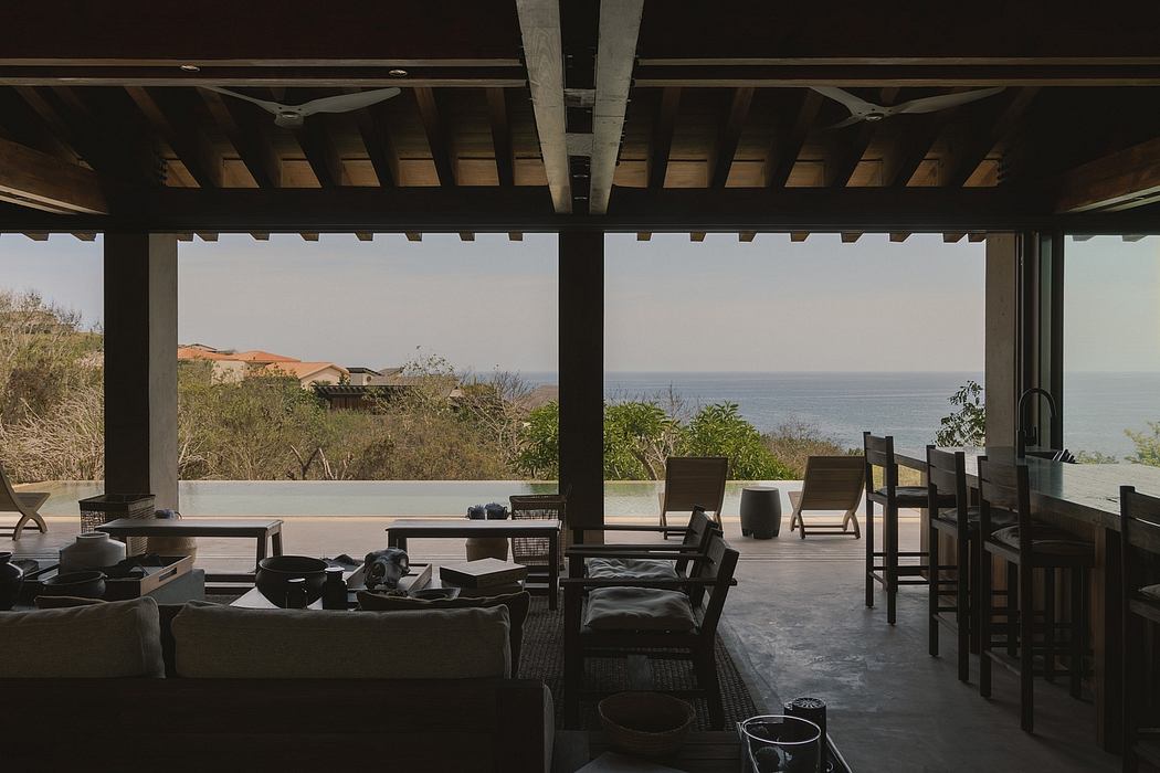 Rustic wooden architecture with expansive views of the ocean and coastline.