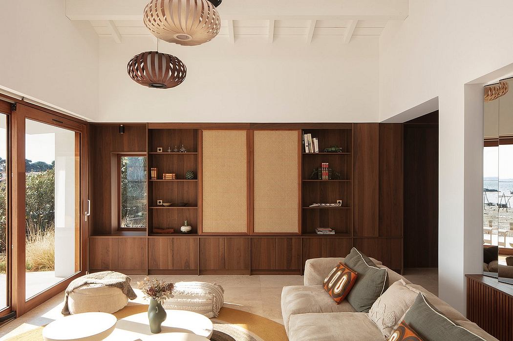 Cozy mid-century modern living room with wooden built-in shelving and warm lighting.