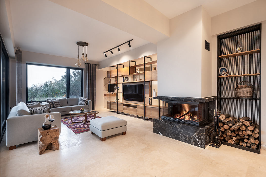 Well-appointed living room with modern furniture, fireplace, and built-in shelving.