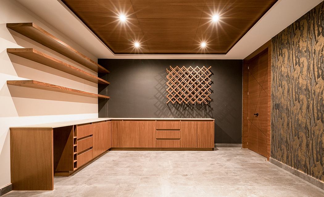 Sleek, modern wooden cabinetry and shelving complement the textured wall feature.