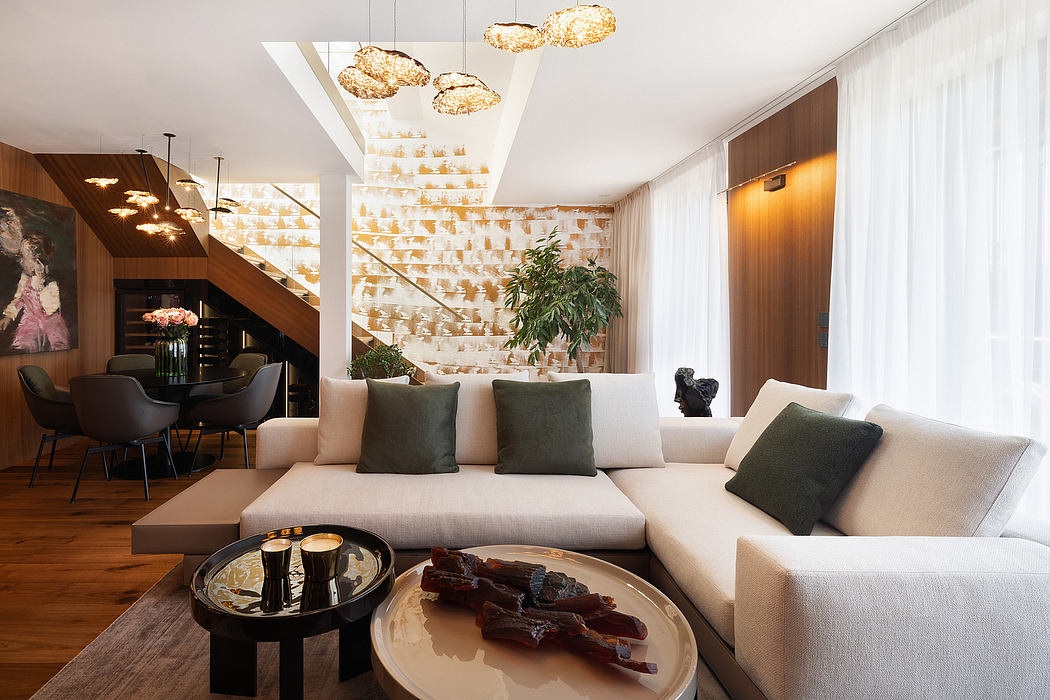 Luxurious living room with sleek furnishings, striking lighting fixtures, and tasteful decor.