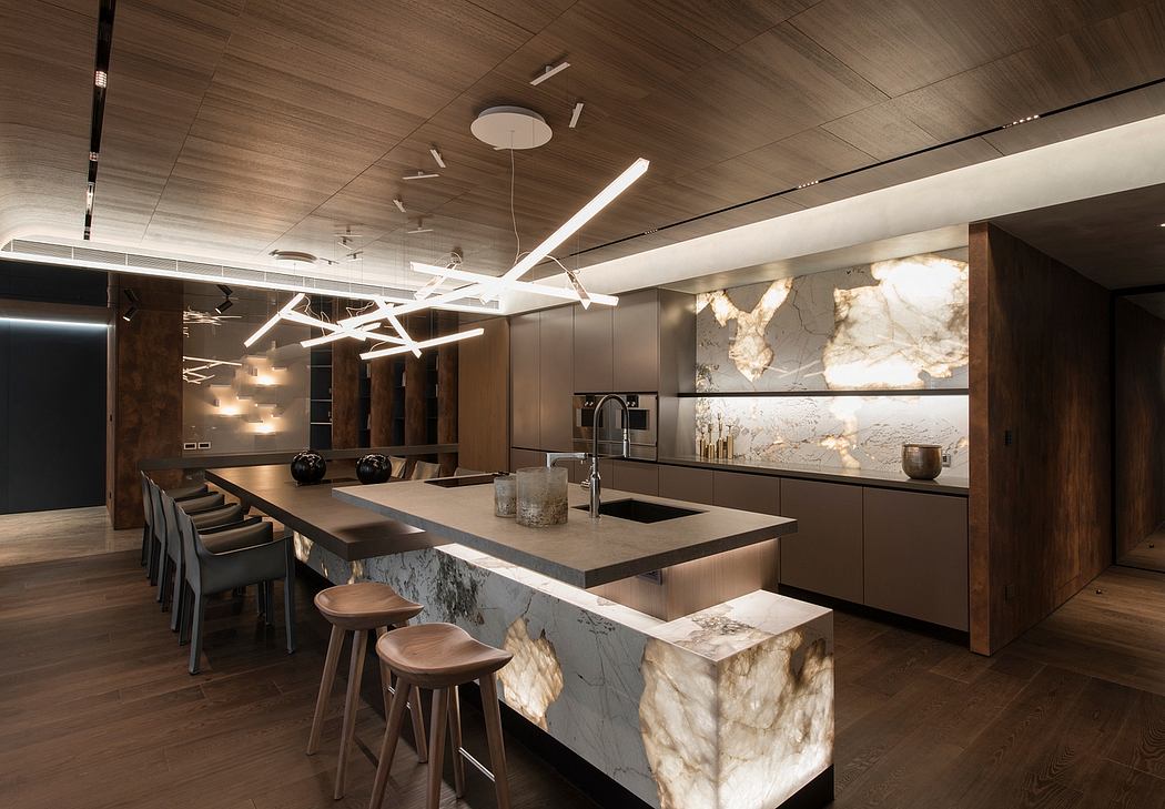Sleek modern kitchen with linear lighting fixtures, marble countertops, and wooden accents.