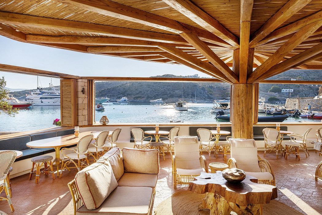 Stunning waterfront restaurant with rustic wooden decor and panoramic views of the harbor.