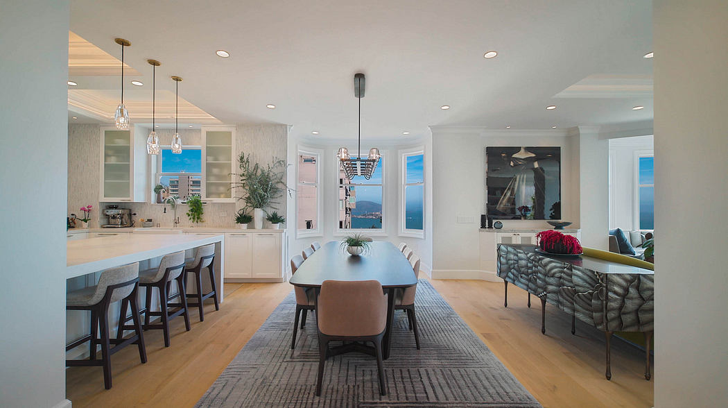 Spacious open-concept kitchen and dining area with modern furnishings and scenic views.