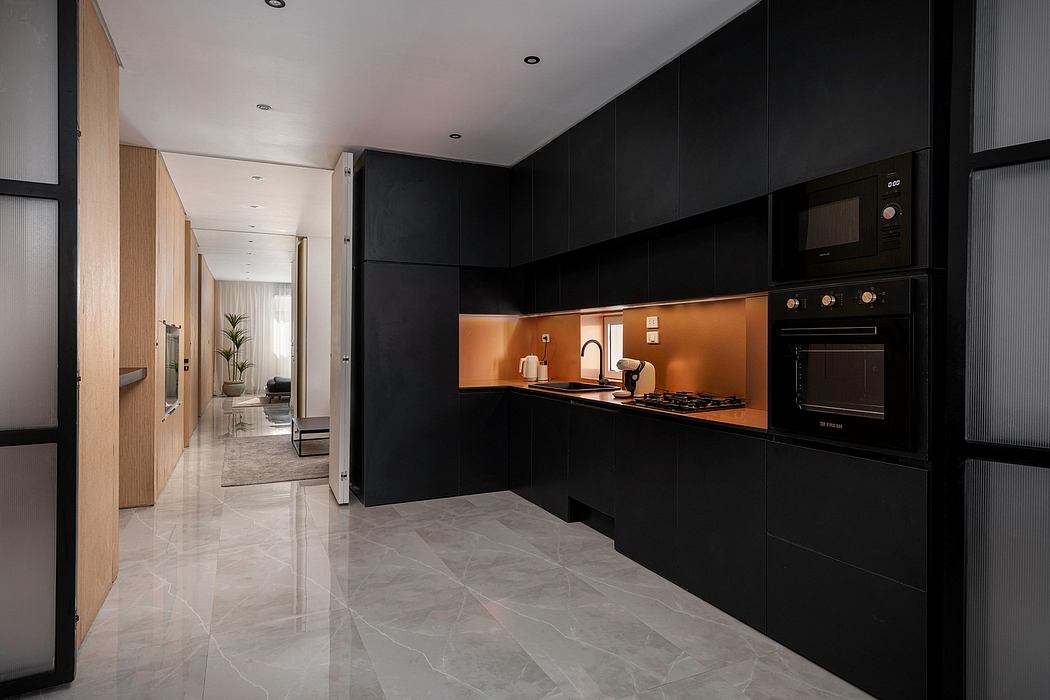Sleek, modern kitchen with black cabinetry, contrasting orange backsplash, and marble floors.