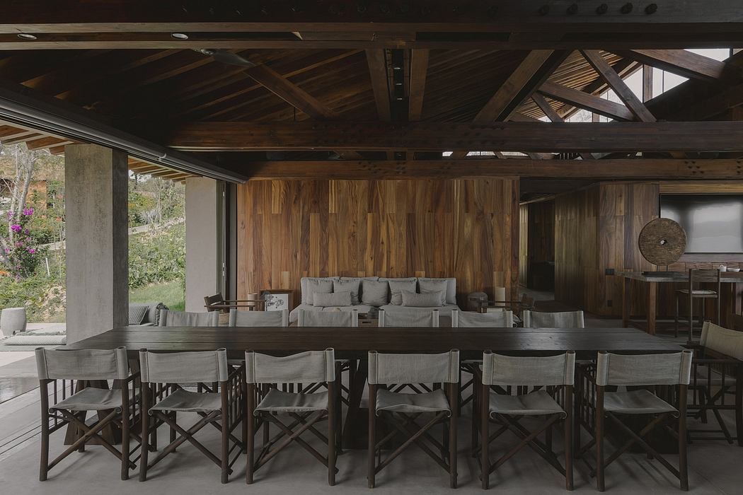 Rustic wooden beams, walls, and furniture create a cozy, natural atmosphere.