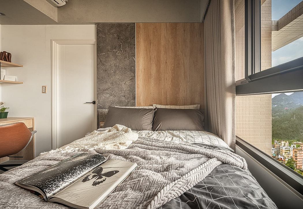 Cozy bedroom with wood paneling, marble accent wall, and expansive window view.