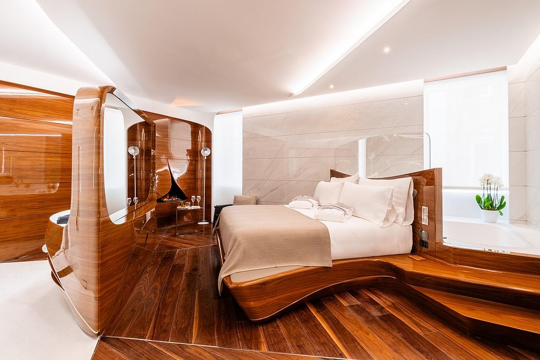 Elegant modern bedroom with wooden furniture, curved bed frame, and glass-enclosed vanity.