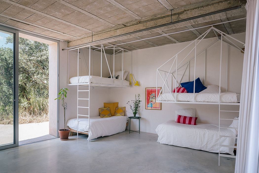 Spacious bedroom with exposed concrete ceiling, bunk beds, and modern furnishings.