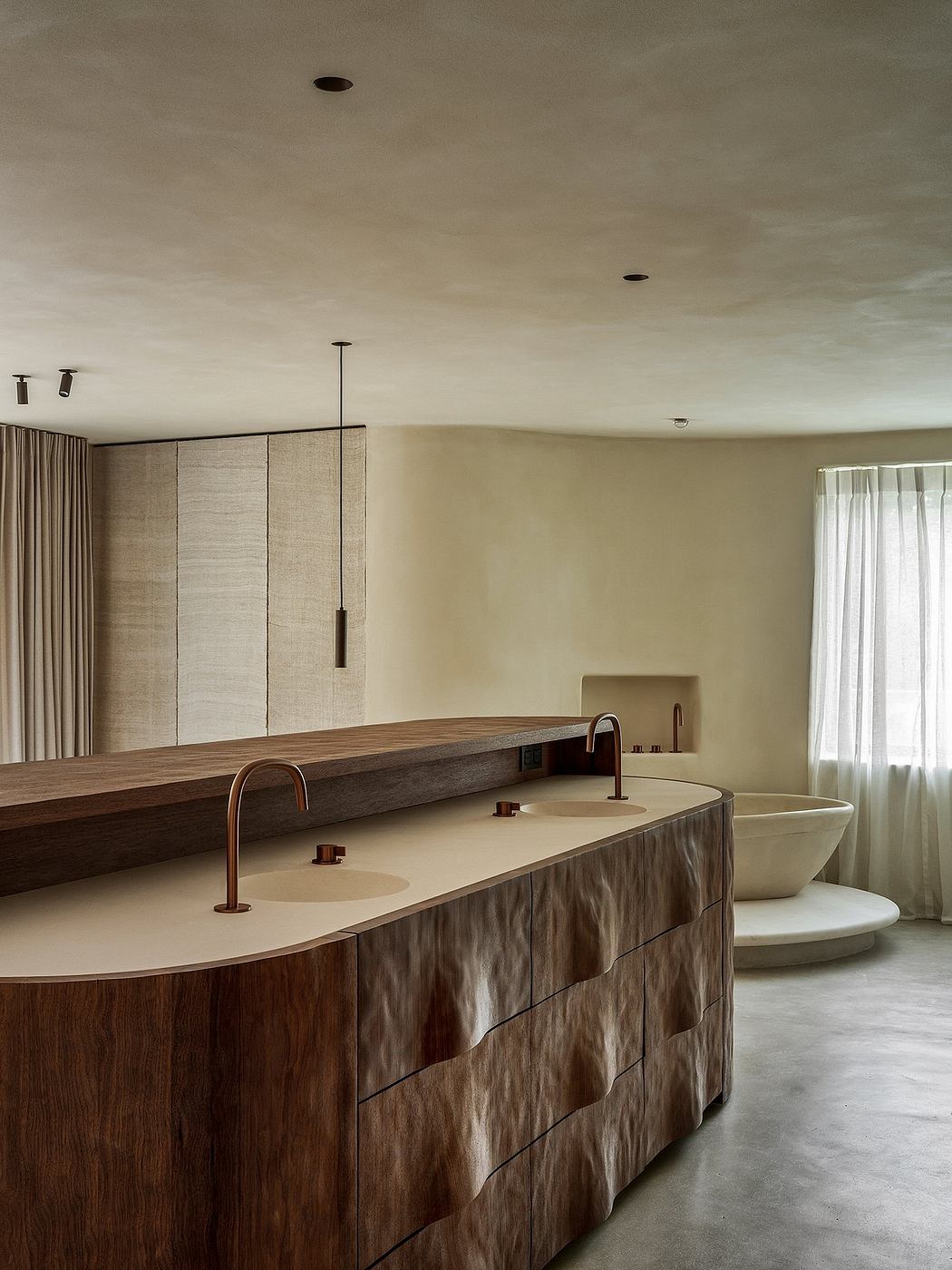 Luxurious bathroom with minimalist wooden vanity, freestanding tub, and pendant lighting.