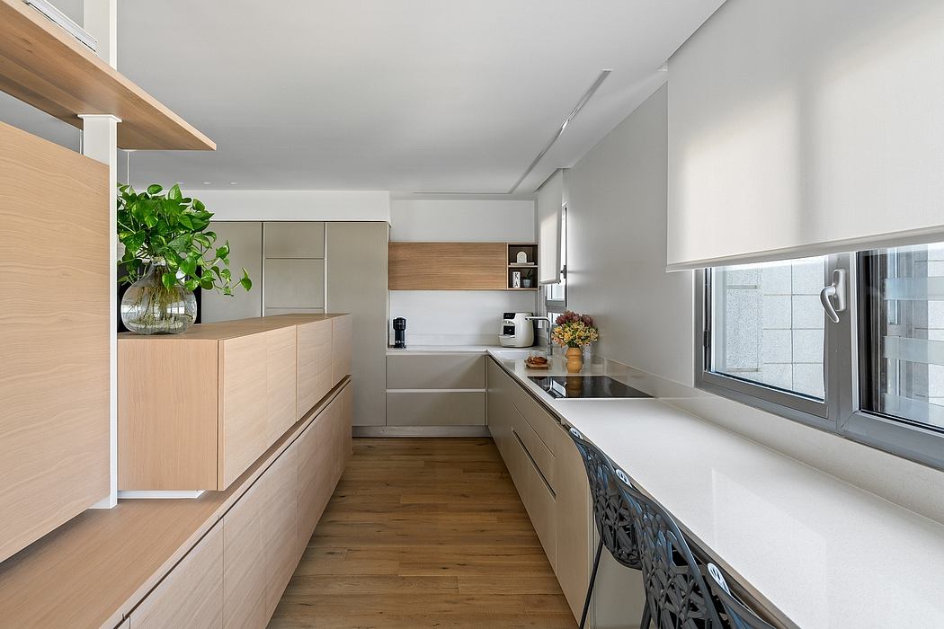 Sleek, modern kitchen with clean lines, natural wood accents, and ample counter space.