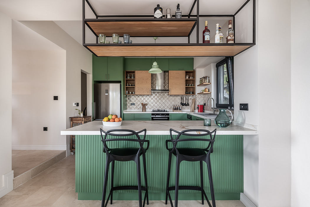 Modern kitchen with green cabinets, open shelving, and minimalist black stools.