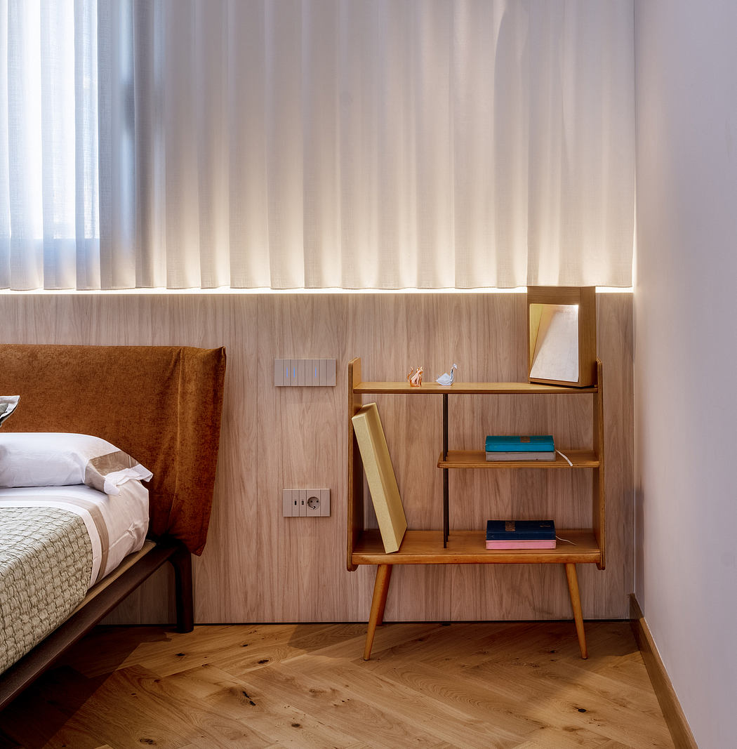 Cozy bedroom with wooden furniture, shelving, and textured curtains creating a warm atmosphere.