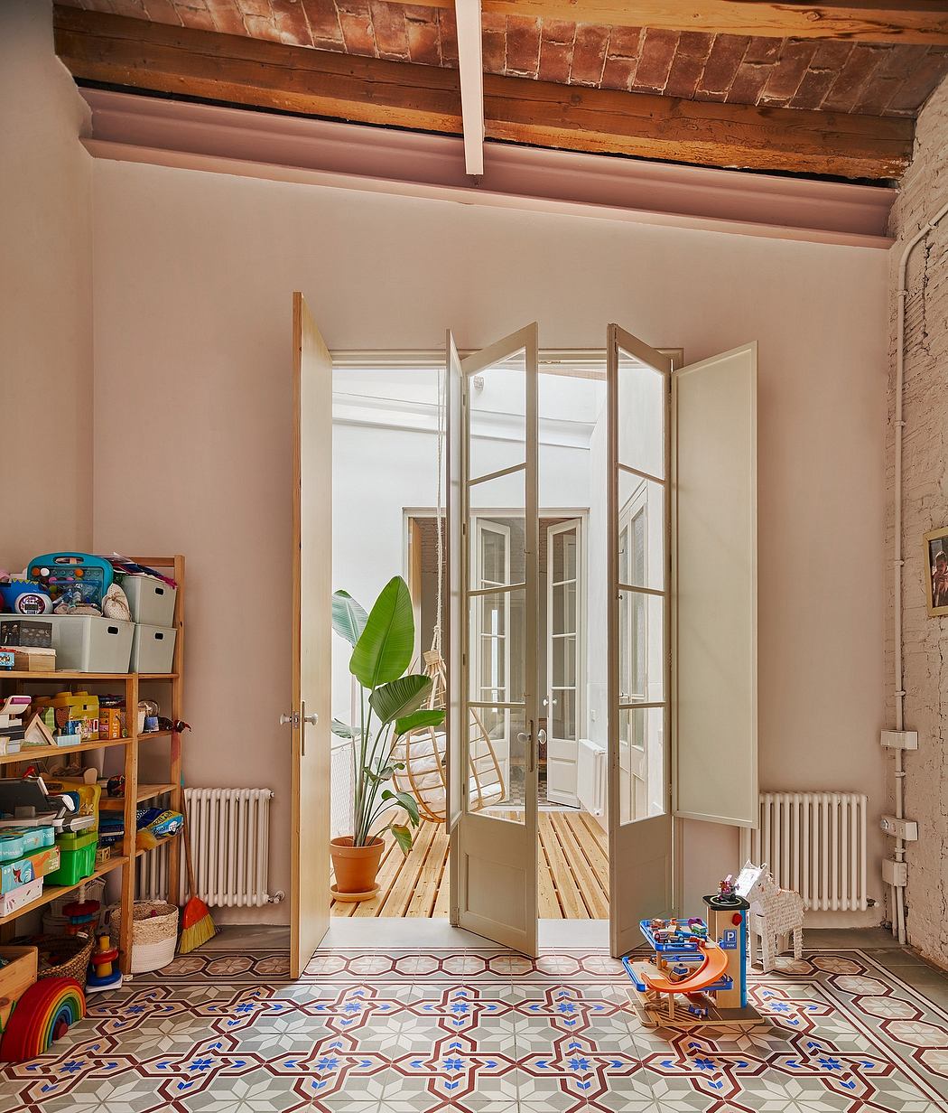 Bright, airy room with arched windows, wood-beamed ceiling, patterned tile floor, and decor.