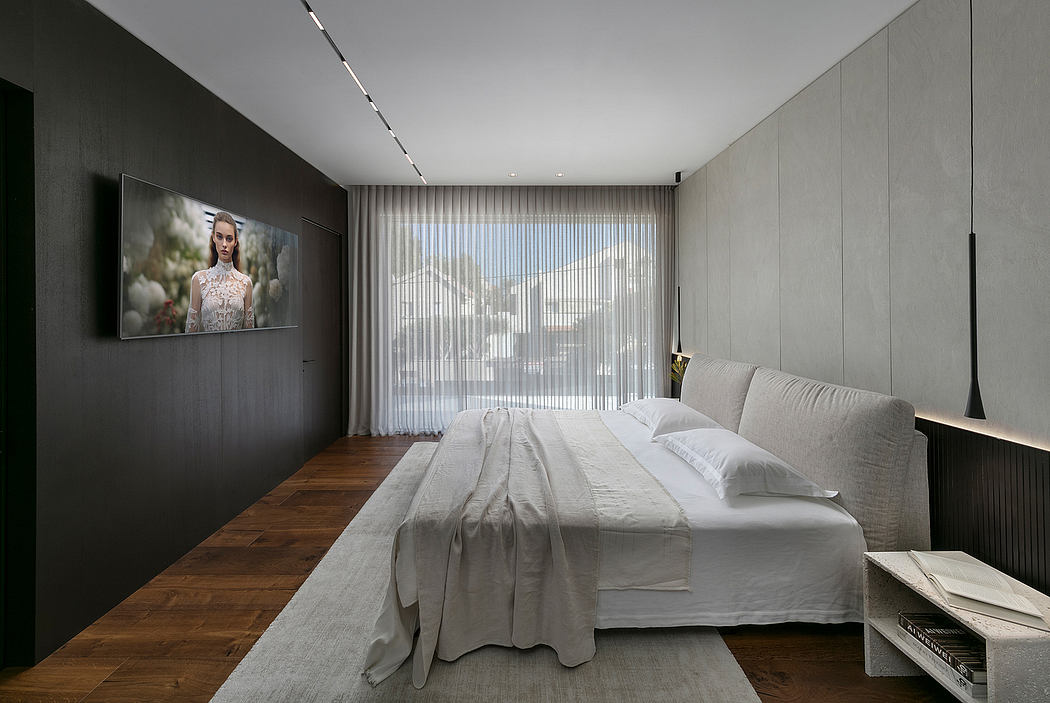 Sleek, minimalist bedroom with gray walls, large window, and modern artwork.
