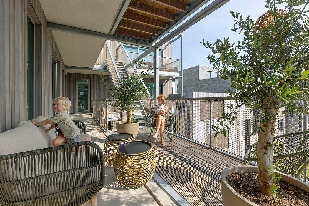 A modern outdoor deck with wooden beams, glass railings, and stylish furnishings.